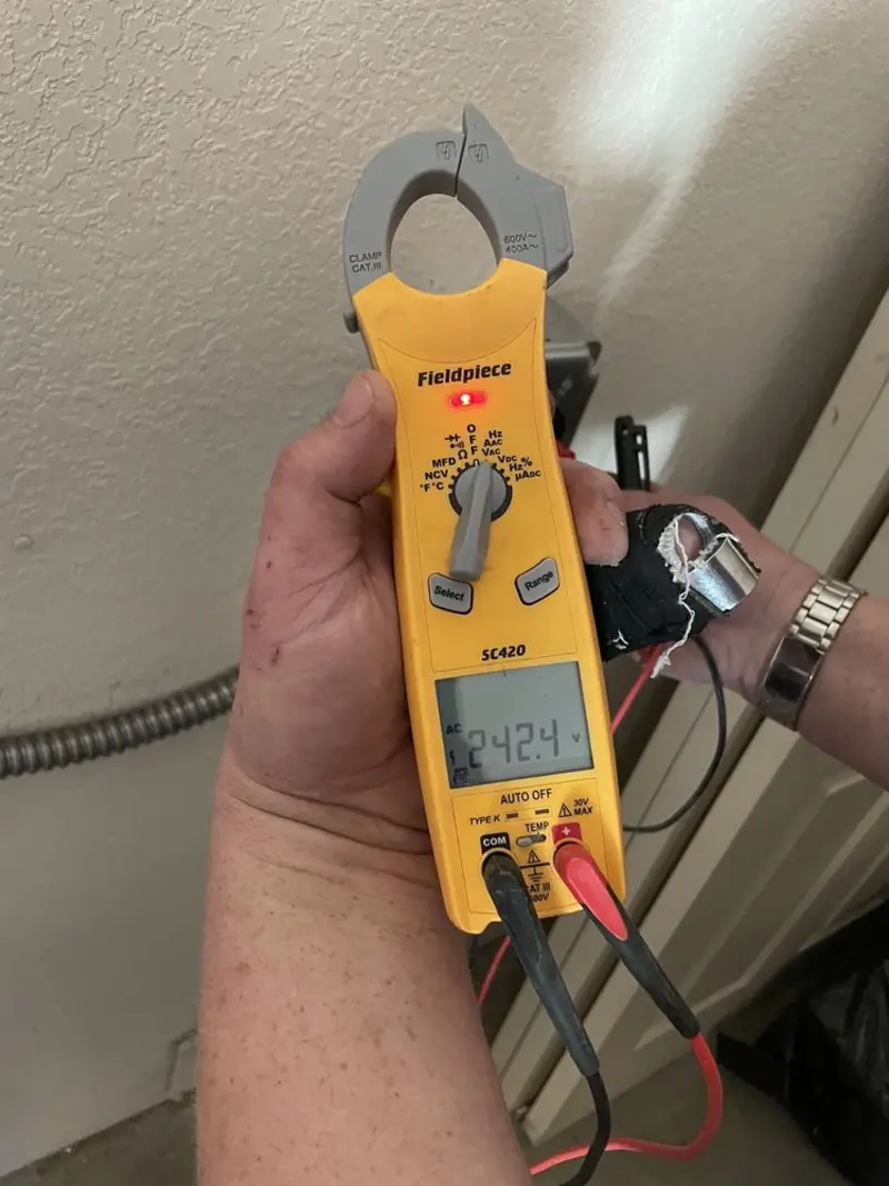 Voltage testing with clamp meter during Electrical Installation Services in Beloit